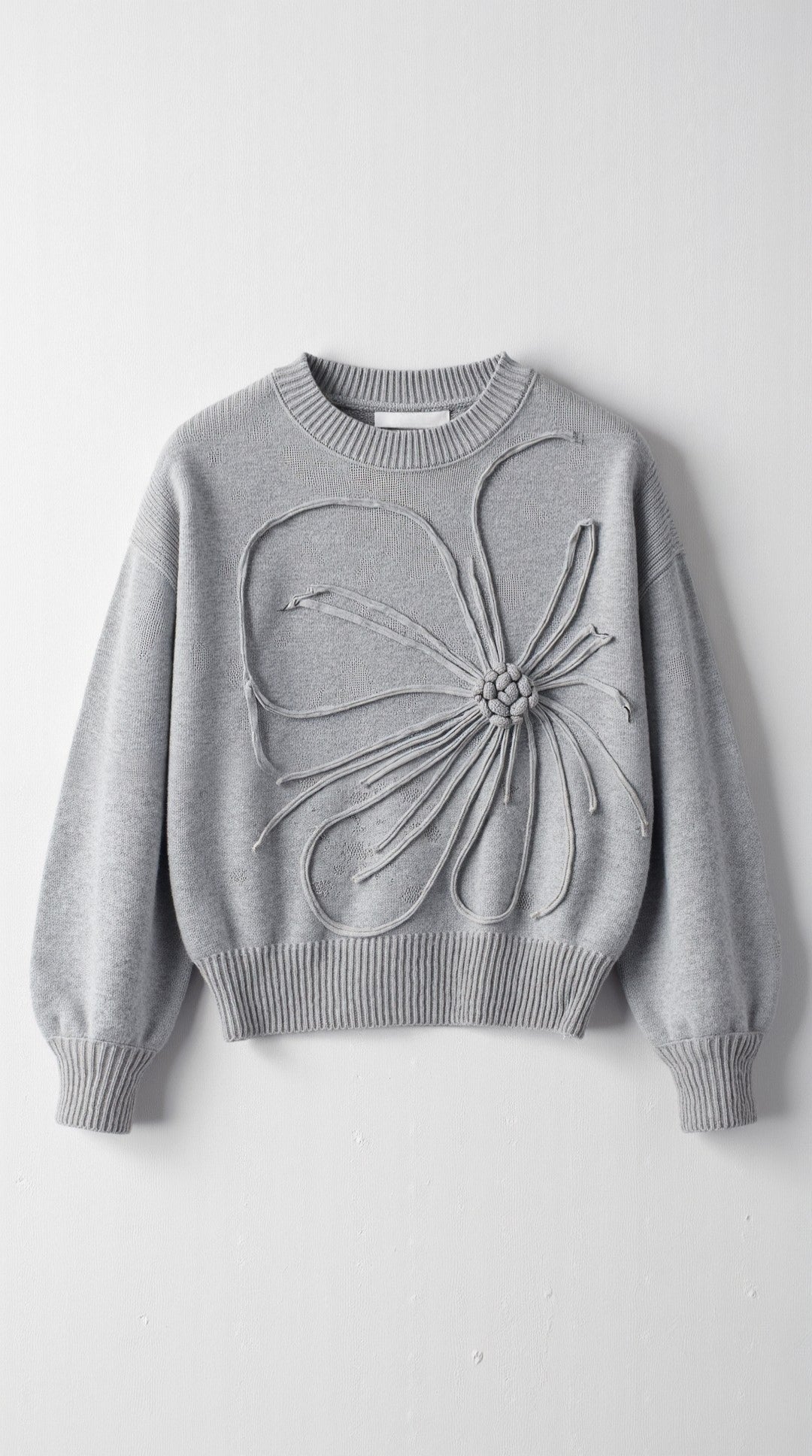 Annie | Jersey de punto con flor en relieve